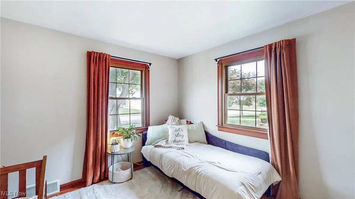 Bedroom with multiple windows