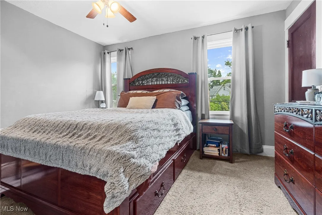 Bedroom with carpet floors and ceiling fan