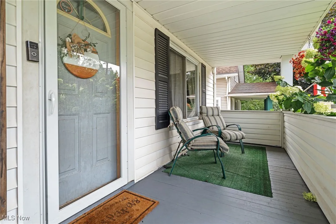 Property entrance featuring covered porch