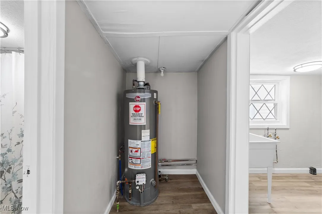 Utility room featuring water heater