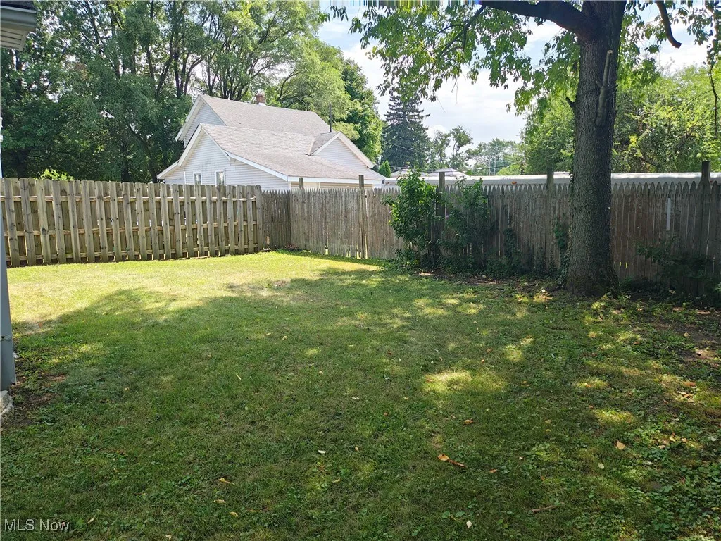 View of fenced backyard