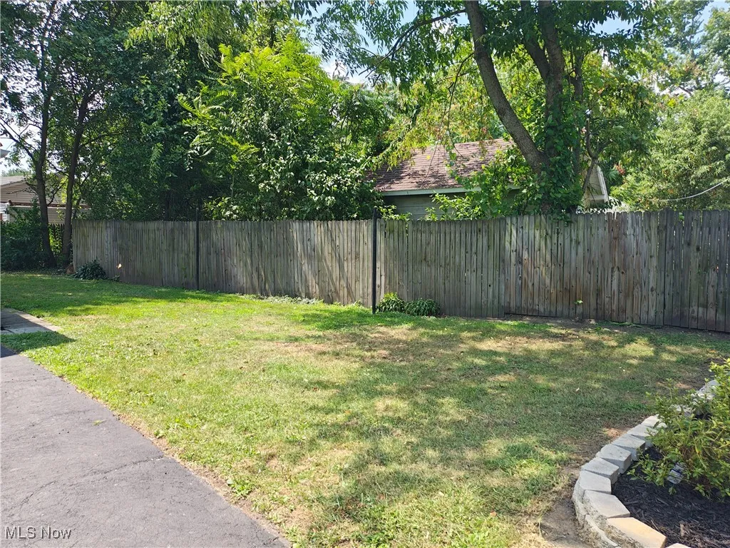 View of fenced backyard