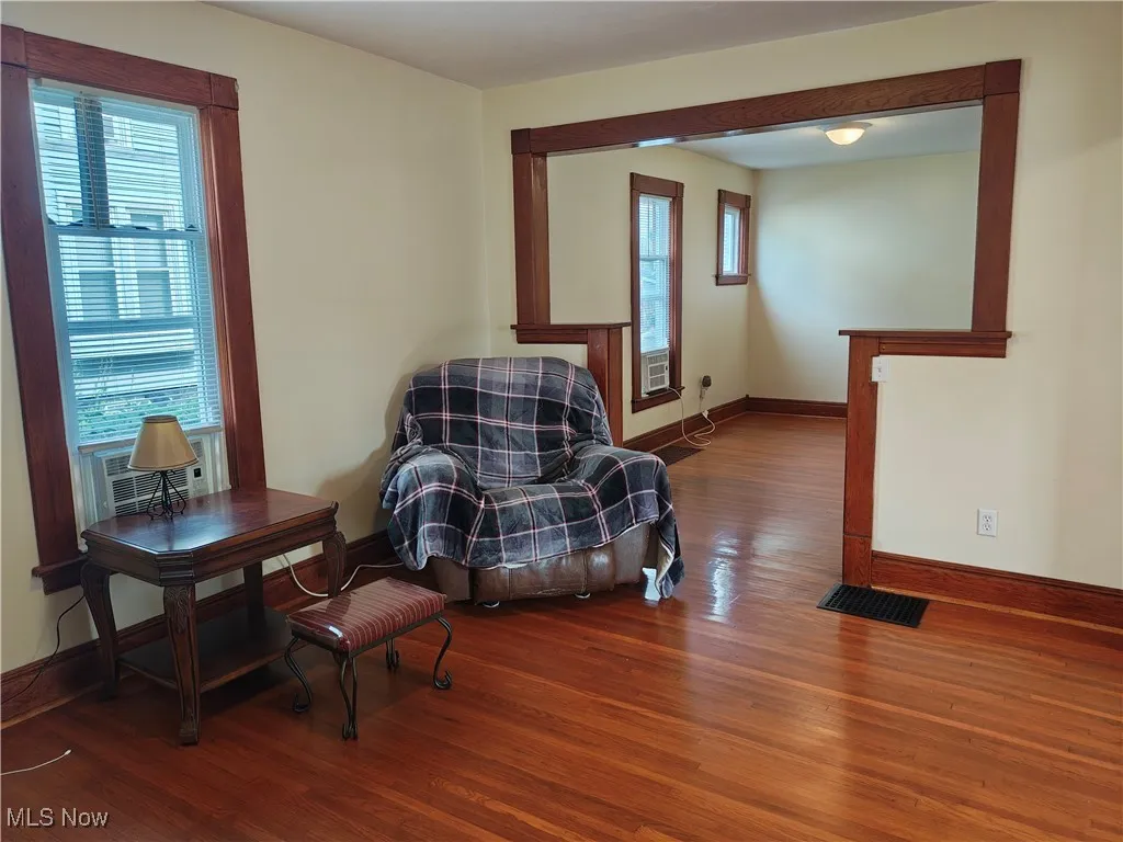 Living area featuring wood finished floors and baseboards