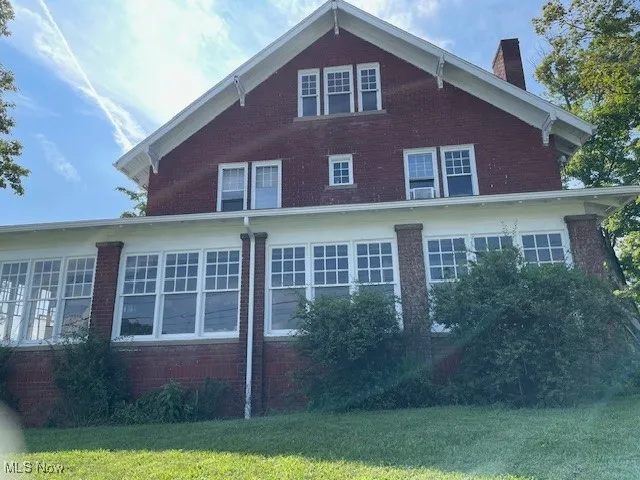 Front  with Huge Enclosed front porch