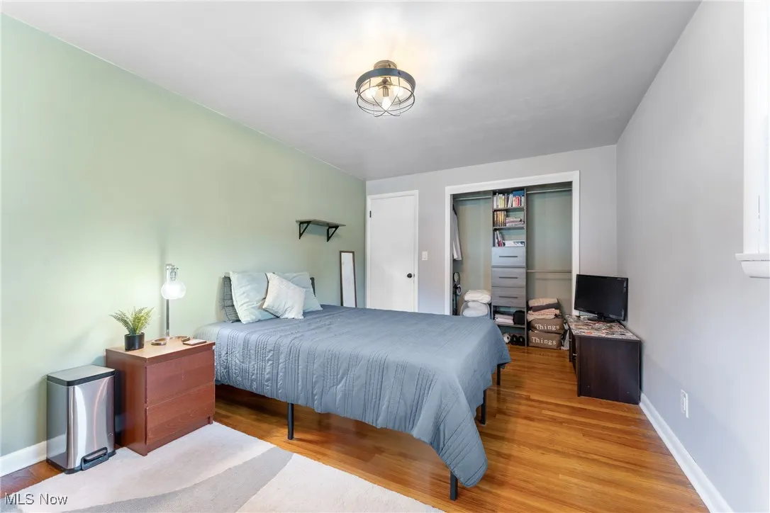 Bedroom featuring baseboards and light wood-style floors