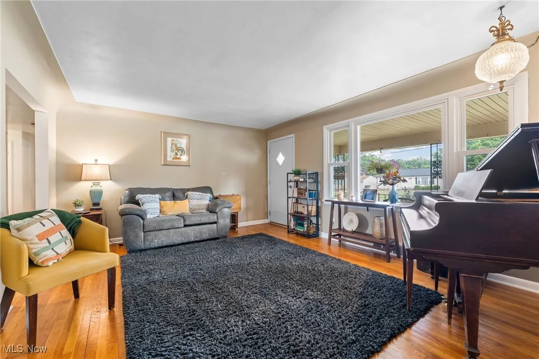 Living area featuring wood finished floors and baseboards