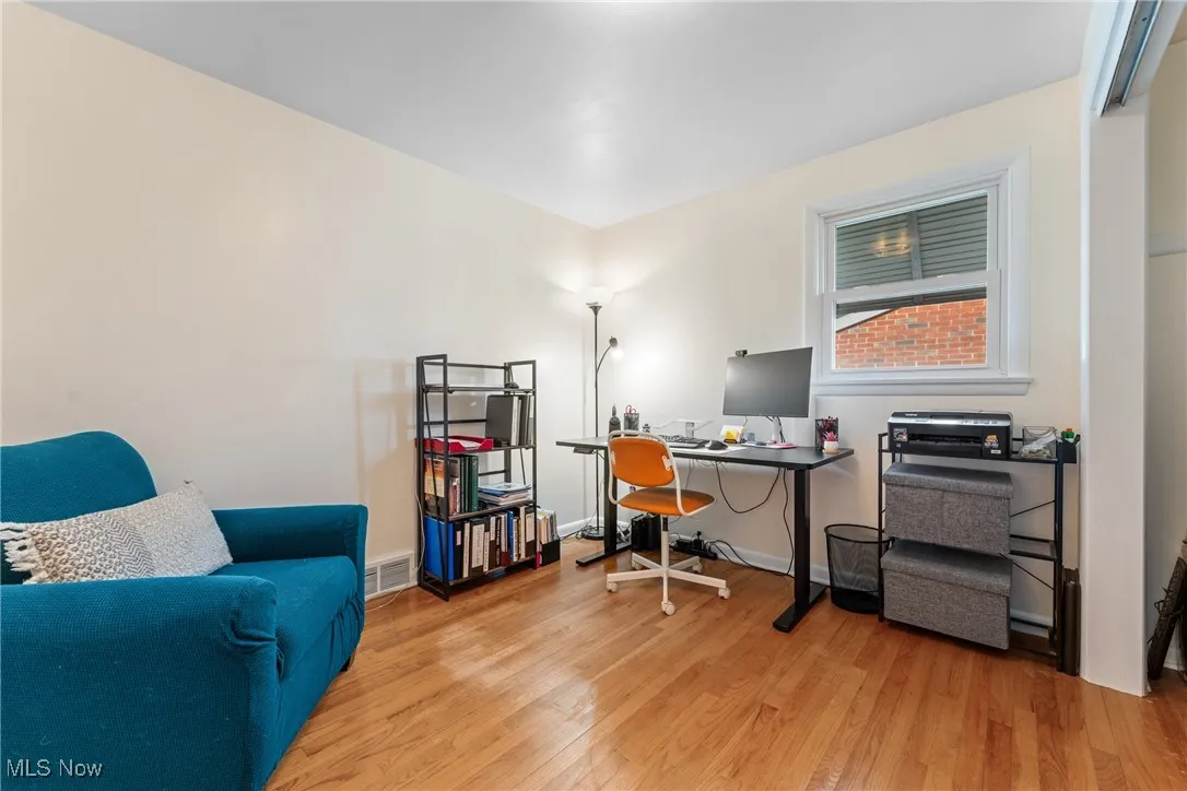 Office featuring wood finished floors and baseboards