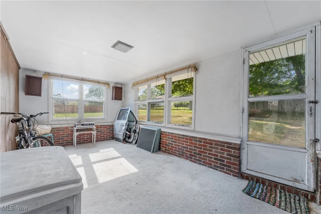 Sunroom featuring plenty of natural light