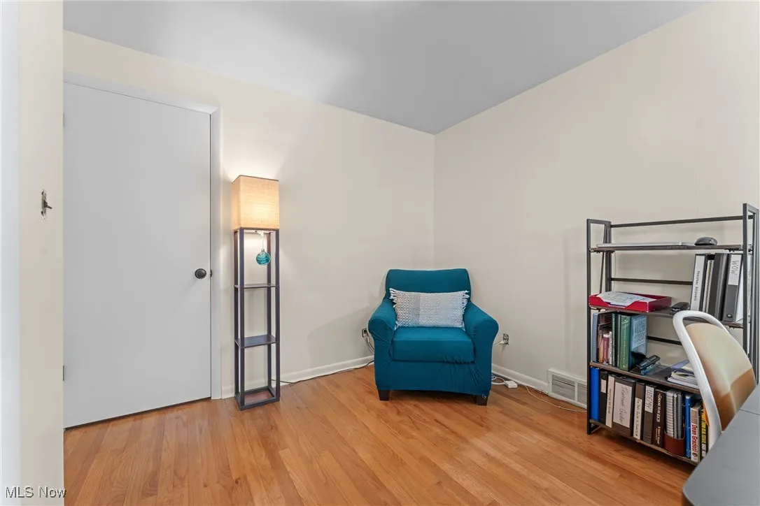 Living area featuring wood finished floors and baseboards