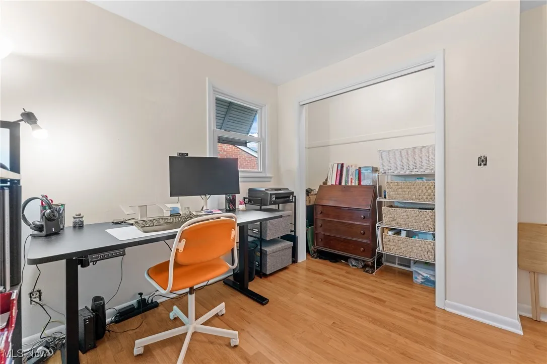 Office area featuring light wood-type flooring and baseboards