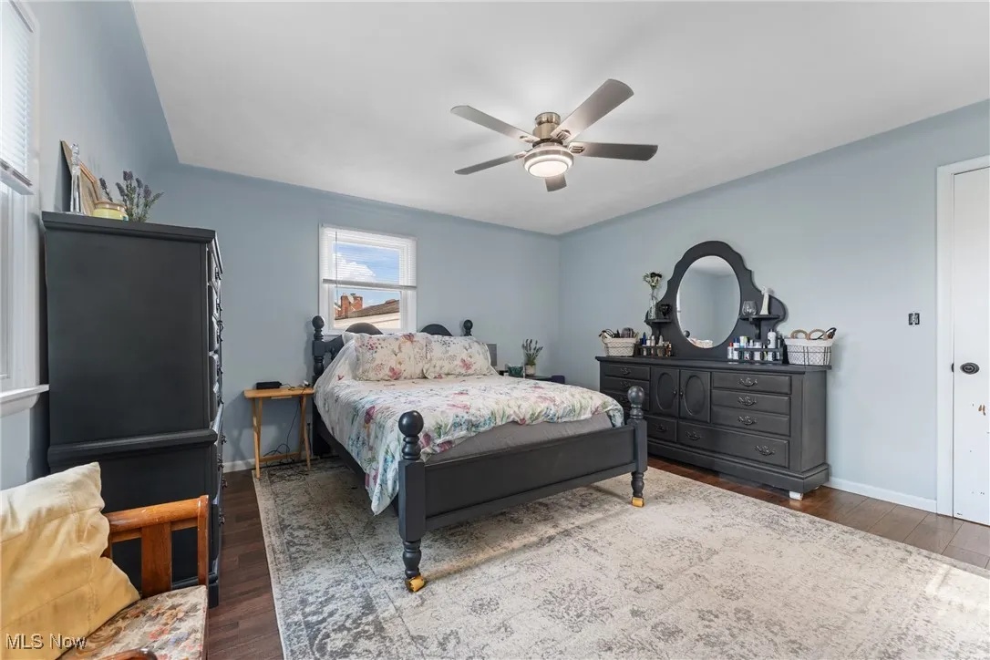 Bedroom featuring wood finished floors and a ceiling fan