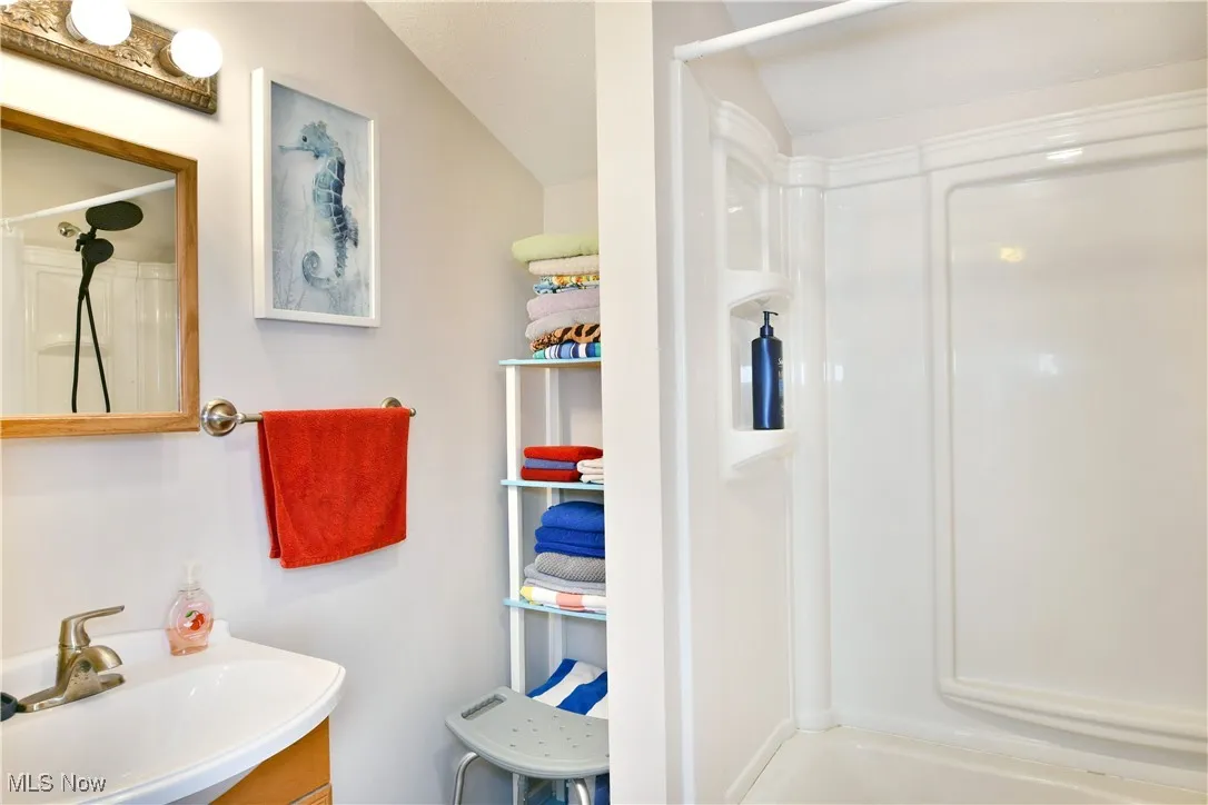 Full bathroom with vanity and shower / washtub combination