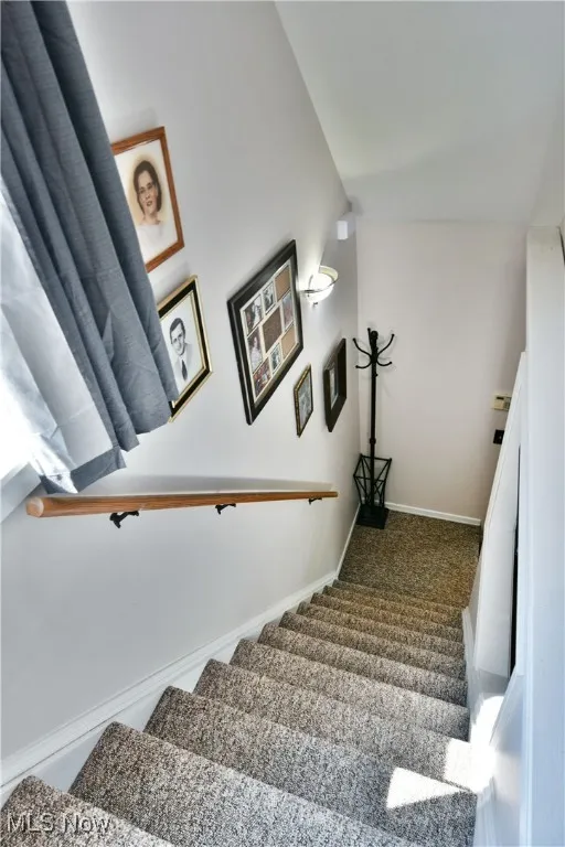 Stairs featuring baseboards