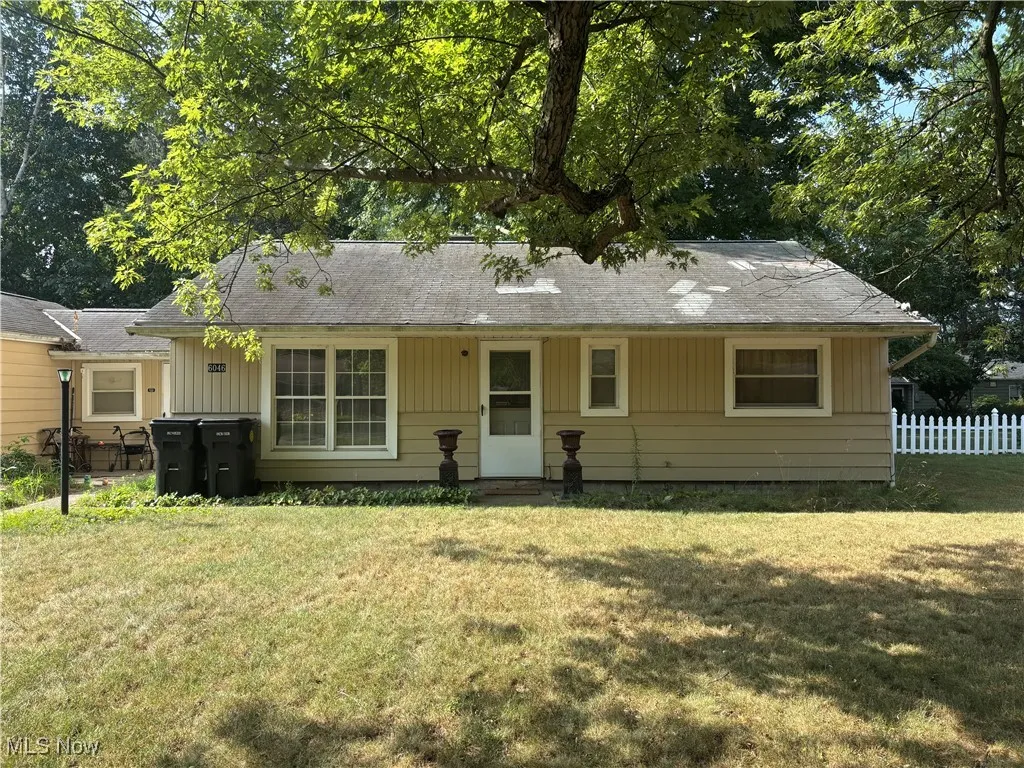 View of front facade with view of scattered trees