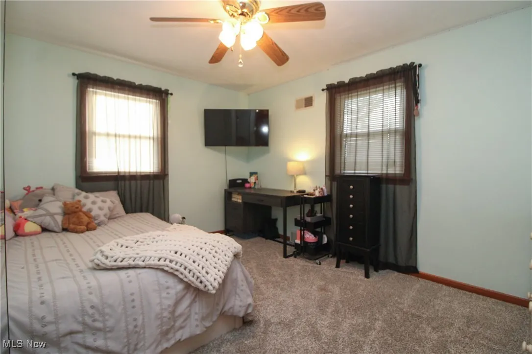 Bedroom featuring carpet floors and a ceiling fan