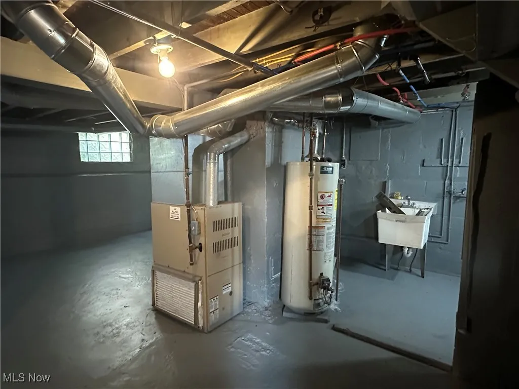 Basement with gas water heater and heating unit