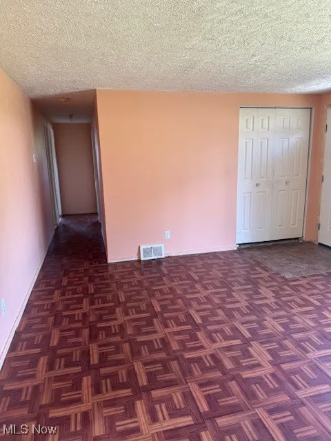 Spare room featuring a textured ceiling
