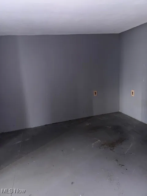 Unfurnished room with concrete floors