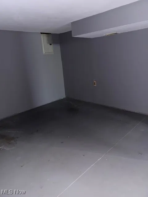 Finished basement featuring electric panel