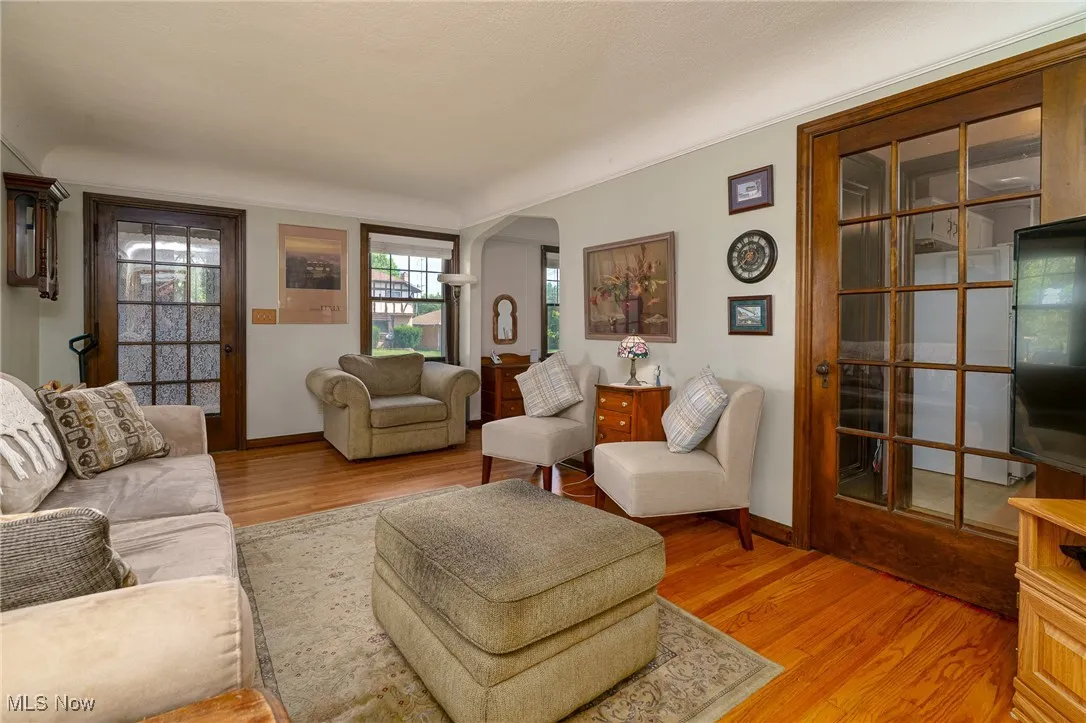 This lovely living room has lots of natural light and accented with beautiful natural woodwork