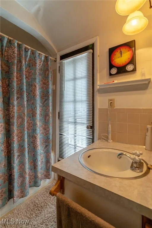Walk out on to the balcony from this floor full bathroom