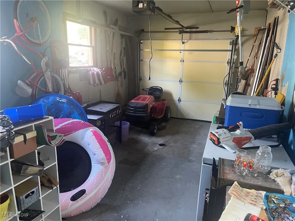 Garage featuring a garage door opener