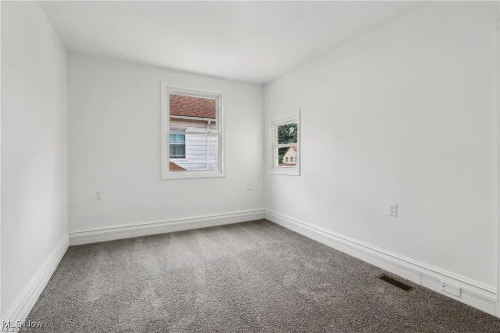 Carpeted Bedoom featuring baseboards