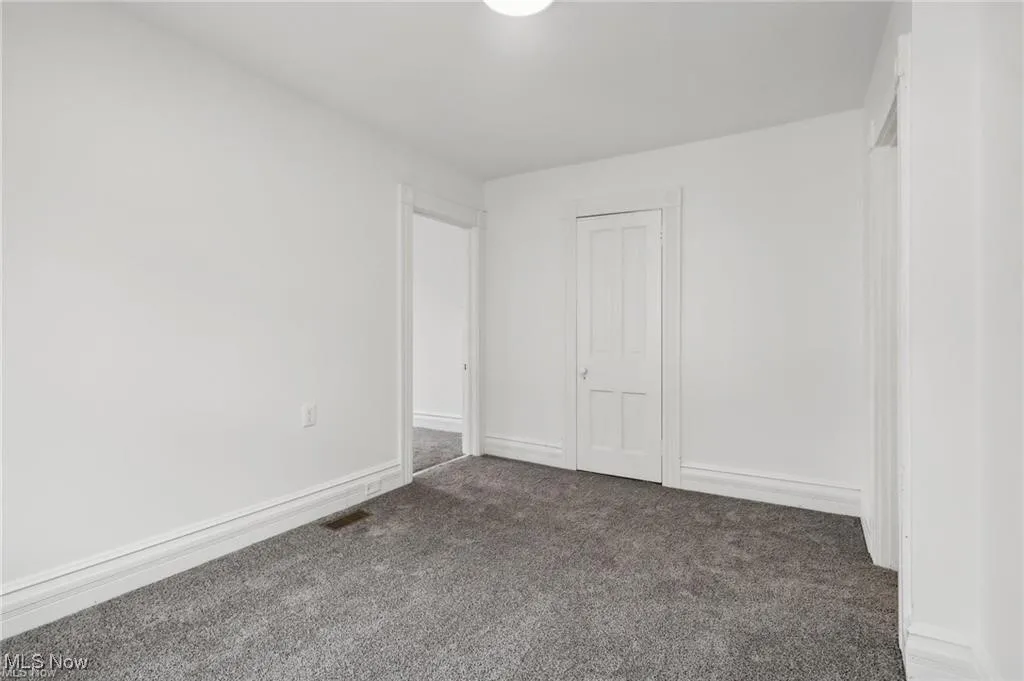 bedroom with carpet and a closet