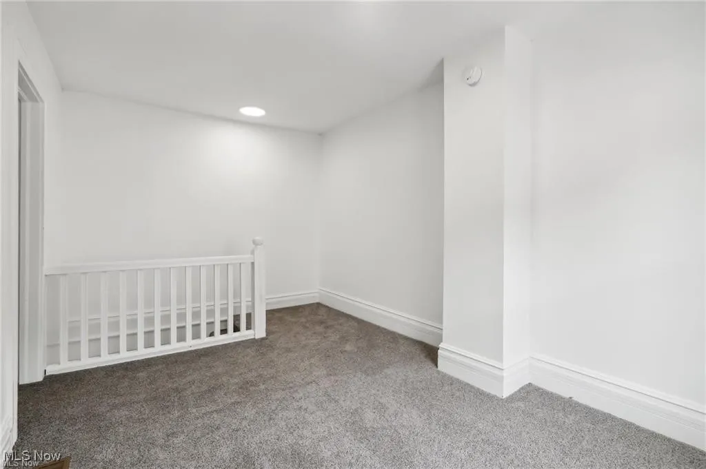 Room featuring carpet floors and recessed lighting