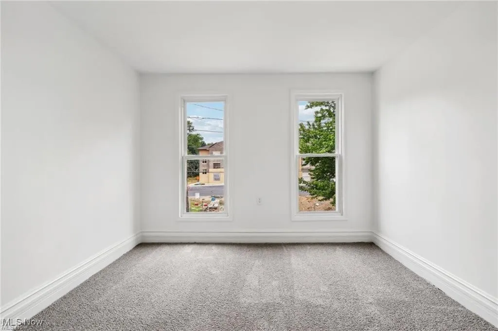 Bedroom featuring healthy amount of natural light and carpet flooring