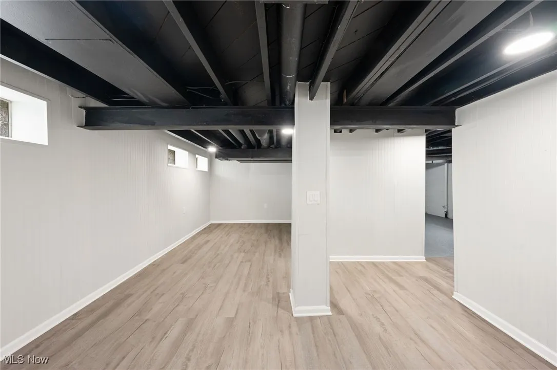 Below grade area with wood finished floors and baseboards