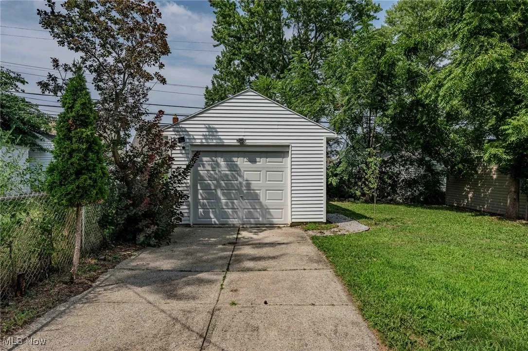 Detached garage with concrete driveway