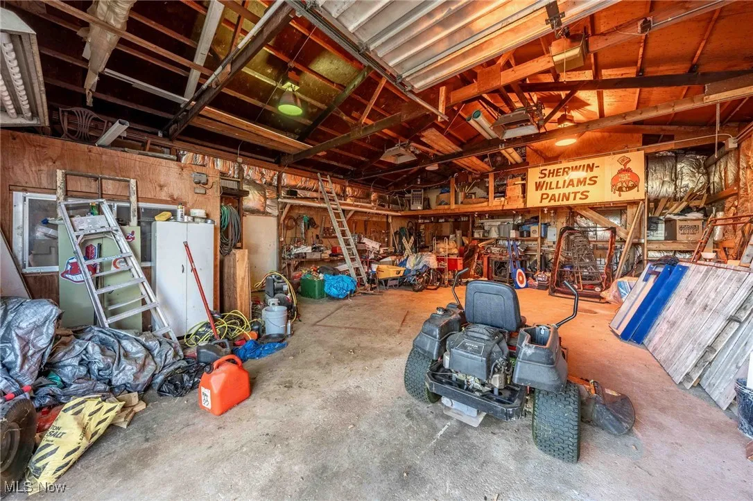 Garage featuring white fridge