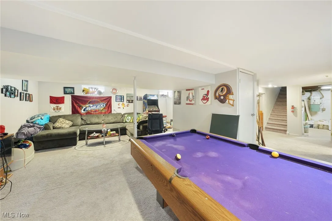 Rec room with carpet flooring and billiards table