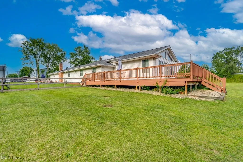 Back of house featuring a deck