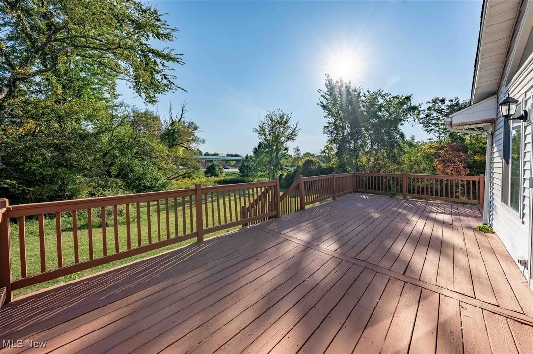 Wooden terrace with a yard