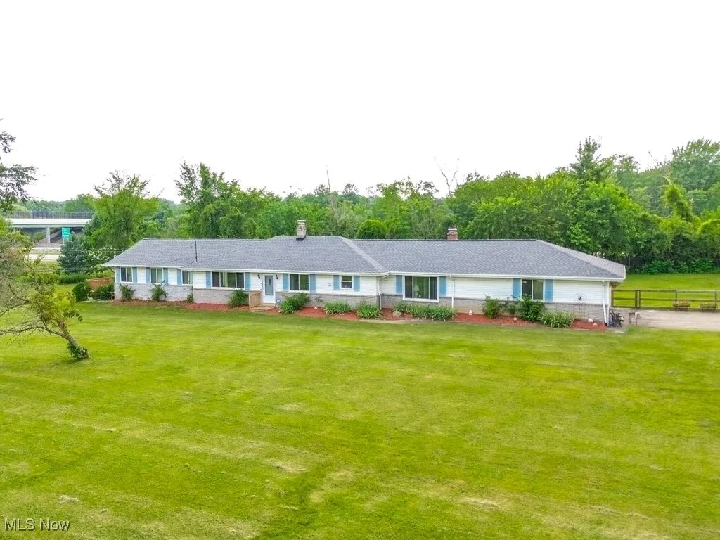 Single story home featuring a chimney
