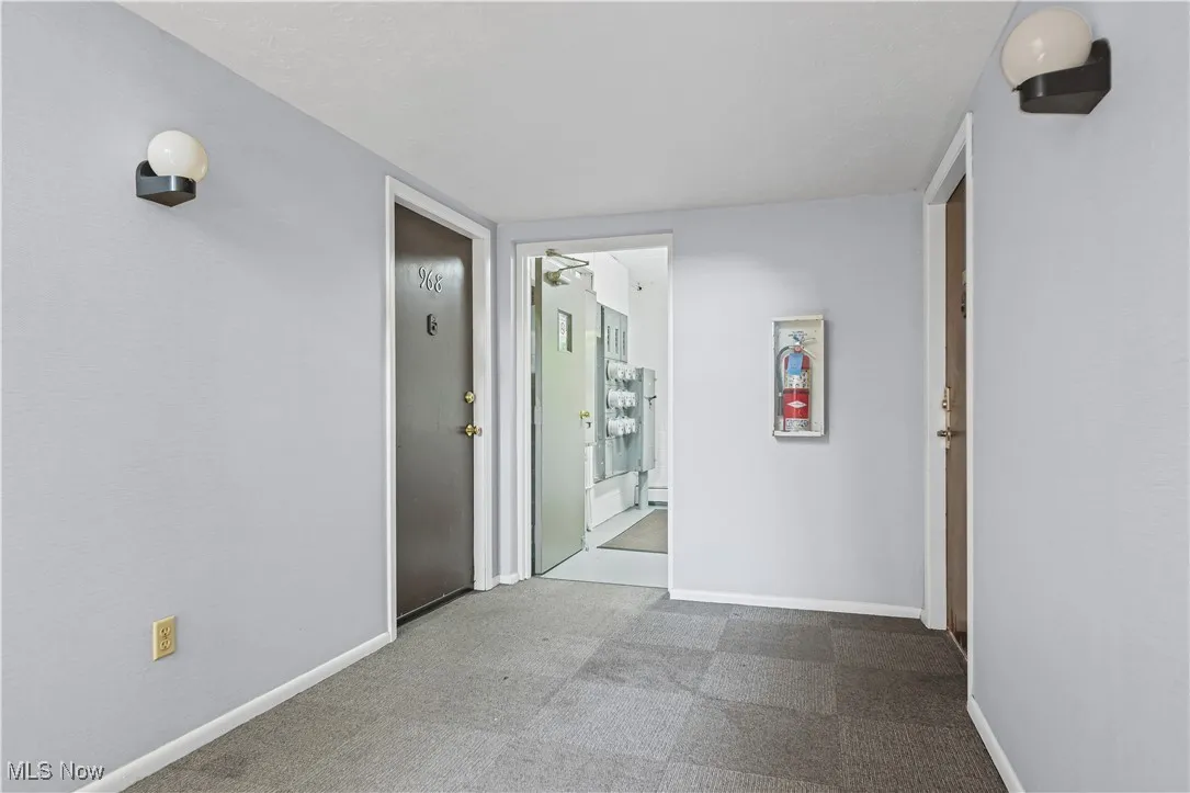 Hallway featuring baseboards
