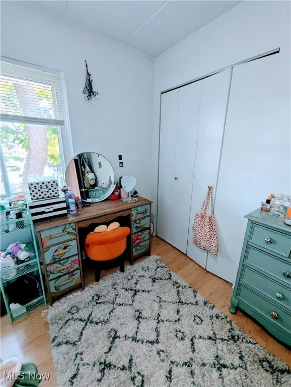 Bedroom featuring light laminate flooring