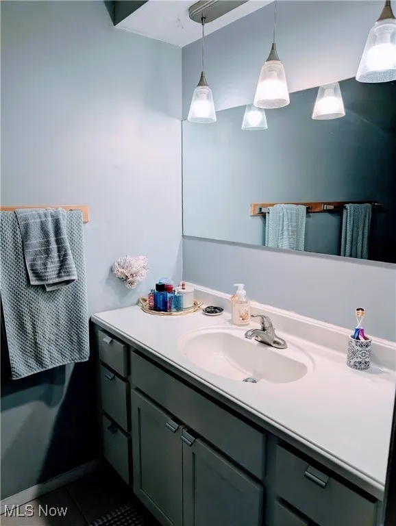 Bathroom featuring vanity and tile patterned floors