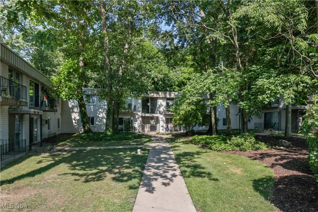 View of property's courtyard with a lawn