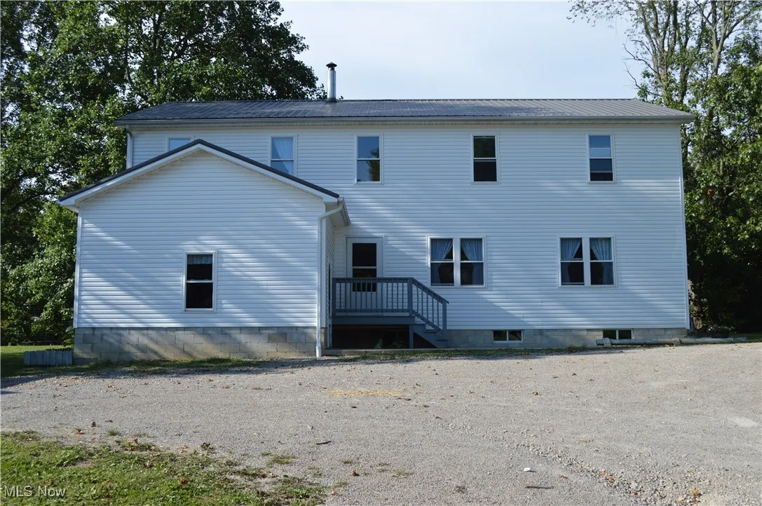 Front view of property featuring a metal roof