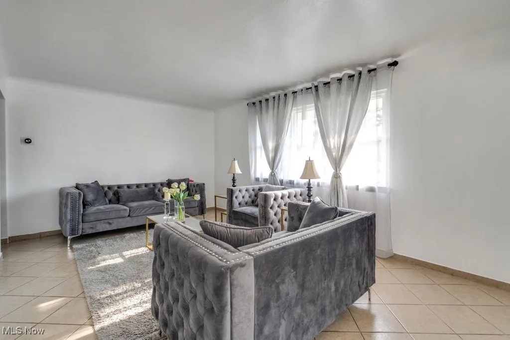 Living area featuring light tile patterned flooring