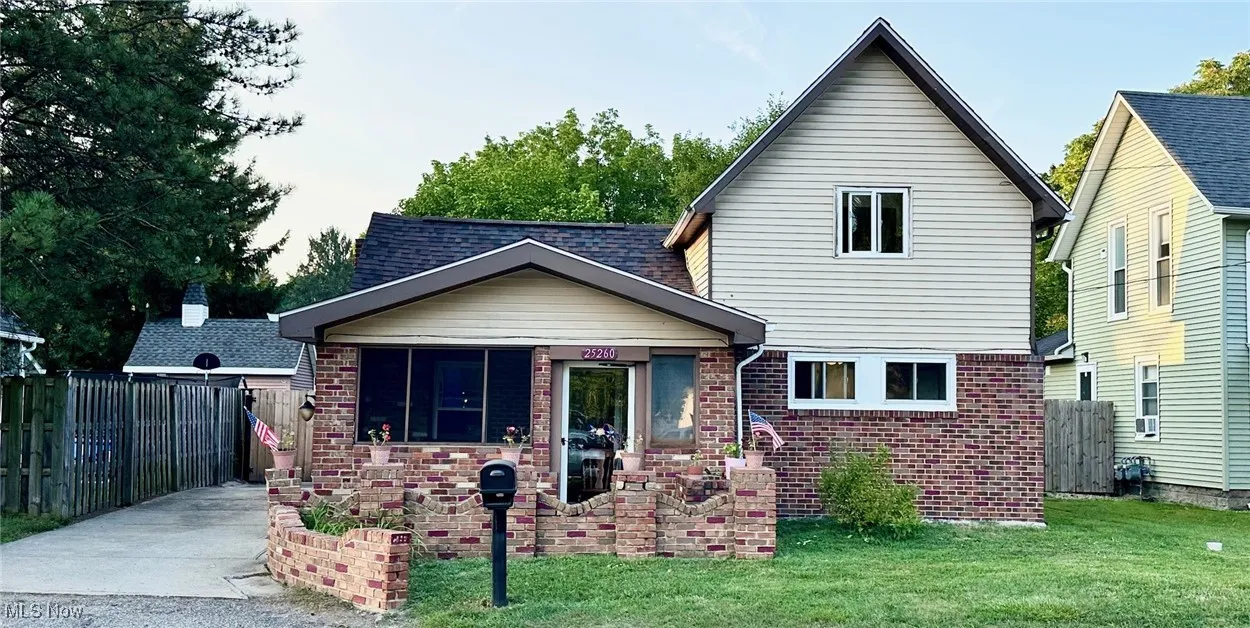 View of front of house featuring brick and siding