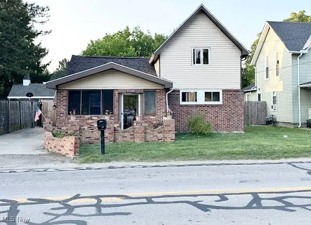 View of front of house featuring brick siding