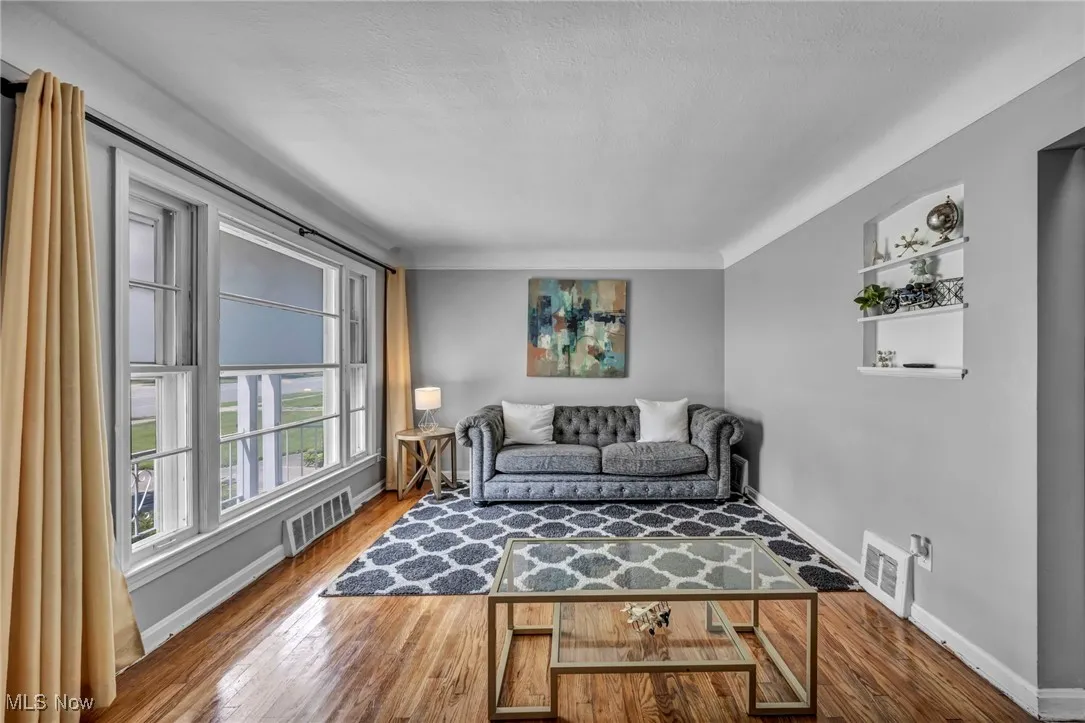 Living room featuring wood finished floors and a textured ceiling