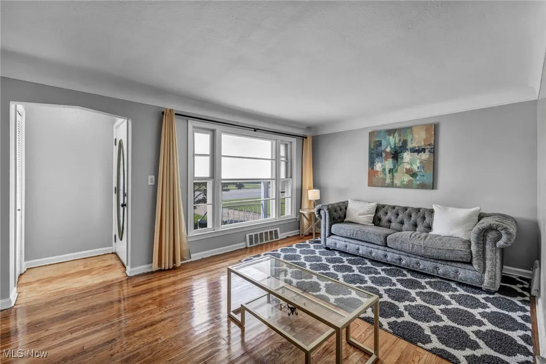 Living room with wood finished floors and baseboards