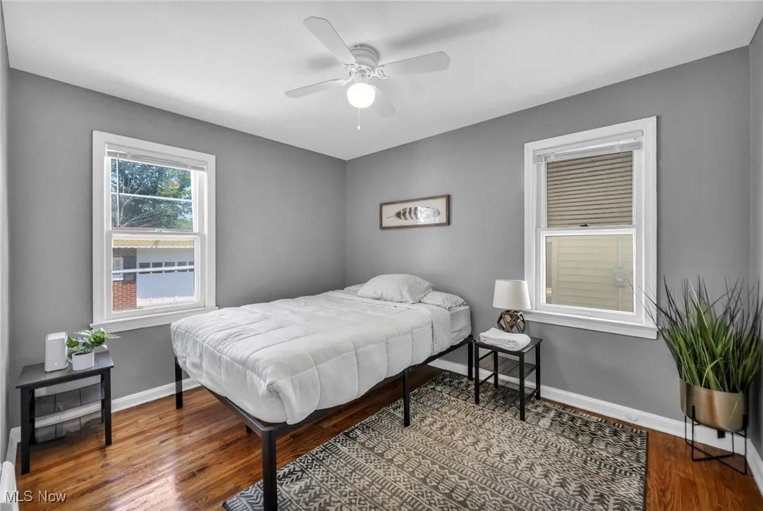 Bedroom featuring wood finished floors and a ceiling fan