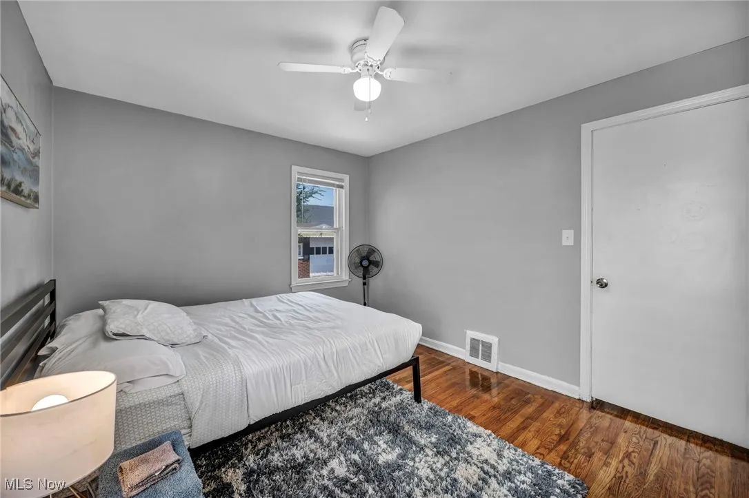 Bedroom featuring wood finished floors and a ceiling fan
