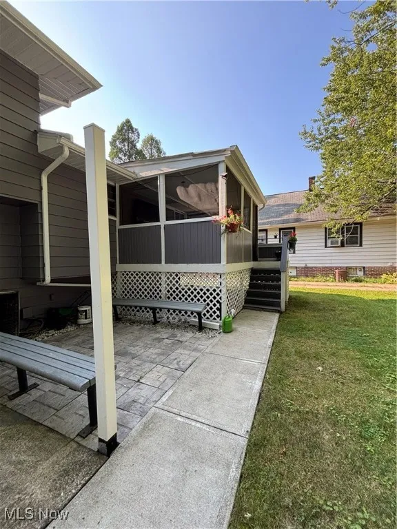 View of back enclosed sunroom
